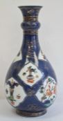 19th century Chinese porcelain powder blue ground famille verte bottle-shaped vase with blue