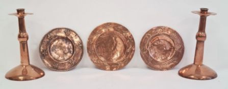 Pair of Arts & Crafts Birmingham School copper candlesticks and three assorted circular copper