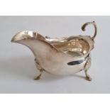 Early 20th century silver cream jug, of plain form with three splayed feet, Birmingham, makers