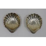 Pair of early 20th century silver scallop-shaped dishes on bun feet, Sheffield, makers H&A, 4oz (2)