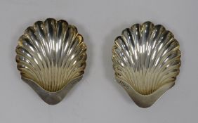 Pair of early 20th century silver scallop-shaped dishes on bun feet, Sheffield, makers H&A, 4oz (2)