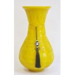 Chinese carved yellow Beijing glass vase, of baluster form with everted neck, carved with key