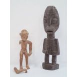 African carved wooden figure of a man holding stick (broken) and another African carved figure (2)