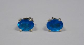 Pair of silver and neon apatite stud earrings