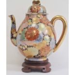 Early 20th century Japanese porcelain oviform teapot, cover and hardwood stand, gilt character