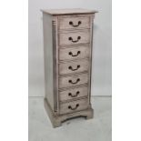 20th century narrow painted chest of seven drawers with fluted column pilasters raised on bracket