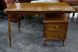 20th century mahogany dressing table with shaped top and moulded edge and two drawers to the right-