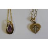 9ct gold heart-shaped pendant set with diamonds in a crucifix, on 9ct gold chain and a 9ct gold