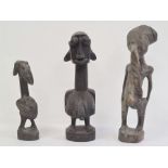 African carved fertility figure, 24cm high, another carved small fertility figure, 17.5cm and a