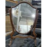 Shield-shaped dressing table mirror and an oval dressing table mirror, both with mahogany frames (2)