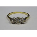 Gold and three-stone diamond ring, total carats 0.5/0.6 approx Condition ReportSize N  several small