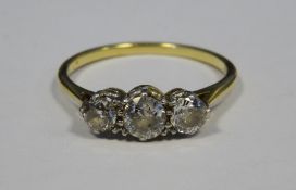 Gold and three-stone diamond ring, total carats 0.5/0.6 approx Condition ReportSize N  several small