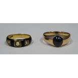 Gold coloured metal, enamel and seed pearl mourning ring and a gold coloured metal and onyx set