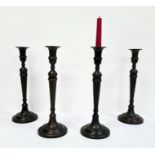 Set of four bronze-effect table candlesticks (4)