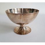 Early 20th century silver circular pedestal bowl of octafoil circular shape, with hammered