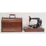 Singer sewing machine, patent number 131986, in wooden case  Condition ReportYes it does have a