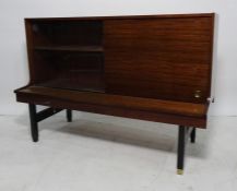 20th century, possibly G-Plan, mahogany lounge unit with one glass and one wooden sliding doors on