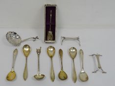 Assorted foreign silver white metal wares to include strainer, teaspoons, knife rests, etc