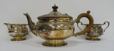 1940's silver teapot, matching milk jug and two-handled sugar bowl with wooden finial and handle,