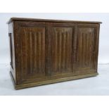 20th century oak blanket box, the rectangular top with moulded edge above a linen-fold decorated