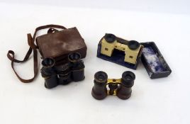 A pair of 20th Century Solus binoculars, no. 389, in fitted case and two other pairs of