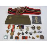 Three WWII medals, miniature set of medals, military badges, three Nelson commemorative coins,