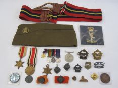 Three WWII medals, miniature set of medals, military badges, three Nelson commemorative coins,