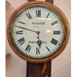 A 20th Century oak circular wall clock, Pearce York St, Westminster, Roman numeral enamel dial, 38cm