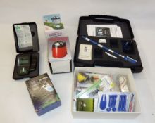 A quantity of golfing accessories to include Technasonic Check-Go sweet spot finder (2), Zelocity '