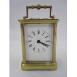 A French carriage clock, Roman numeral enamel dial, 10.5cm high not including handle