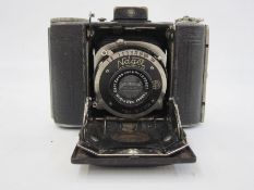 A Nagel Vollenda folding camera with Carl Zeiss Jena lens, Nr 1272921, 11cm wide