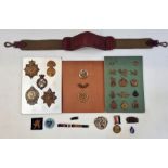 Quantity of military badges (1 tin and 1 bag) Condition ReportSliders and lugs intact (some slightly