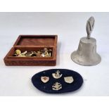 A small quantity of military badges and buttons in wooden box and a RAF Benevolent Fund bell