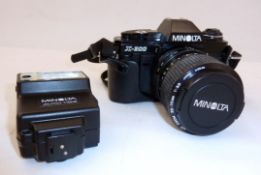 Minolta X-300 camera with Minolta MD zoom lens, in case