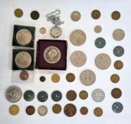 An undated 20p coin and a small quantity of English and foreign coins in tin