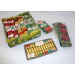 A quantity of vintage Christmas crackers and ribbon