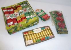 A quantity of vintage Christmas crackers and ribbon