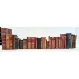 Various volumes to include Walter Scott, George Elliot, Goethe, a New Testament with carved olive