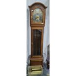 Reproduction longcase clock by Interlock, the arched hood enclosing gilt dial with silver bezel,