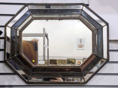 Wall mirror of elongated octagonal form in multi plate mirrored frame, probably early 20th