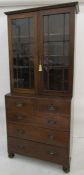 Early 20th century oak bookcase chest with astragal glazed doors enclosing shelves, above chest of