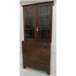 Early 20th century oak bookcase chest with astragal glazed doors enclosing shelves, above chest of