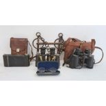 'Anslo' folding camera in brown leather case, a pair of Prinz 8x30 binoculars in brown leather case,