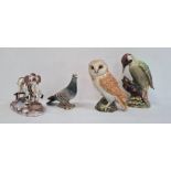 Three various Beswick ceramic model birds to include a woodpecker, an owl and a wood pigeon and a