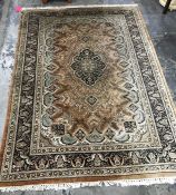 A Persian style rug central medallion foliate decoration borders  in dark brown and green;