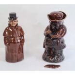Treacle glazed Toby jug and a pottery figure decanter, a Chinese soapstone miniature model of a