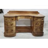 19th century mahogany kneehole dressing table, the shaped top with gallery back, central drawer