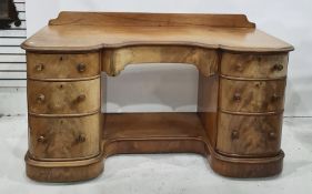 19th century mahogany kneehole dressing table, the shaped top with gallery back, central drawer