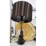 Maison table lamp with circular stepped design and a black satin lampshade