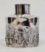 Early 20th century silver tea canister of oval straight-sided form, with repousse decoration of